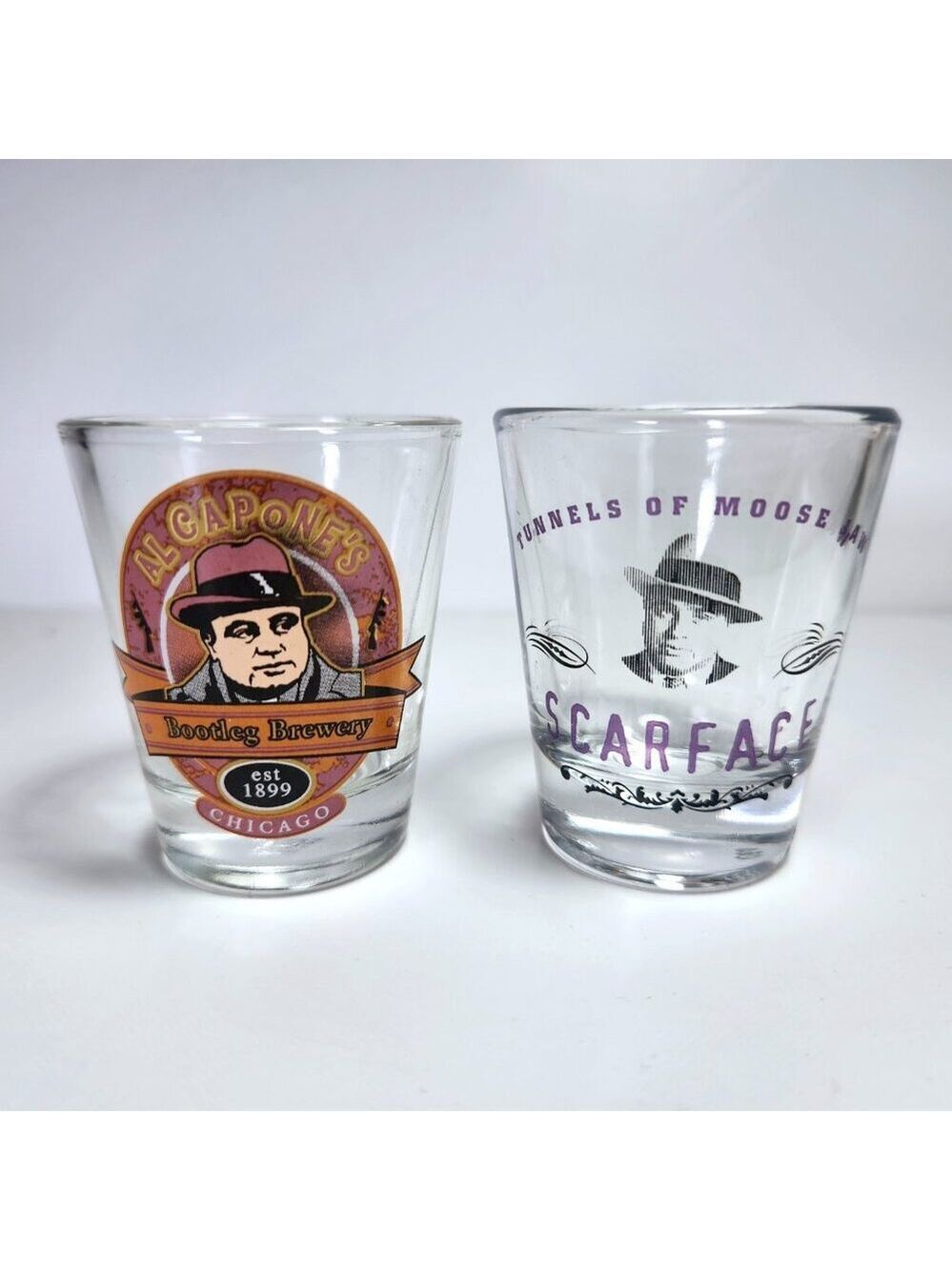 Al Capone Shot Glasses Lot of 2 Scarface Bootleg Brewery Tunnels of Moosejaw